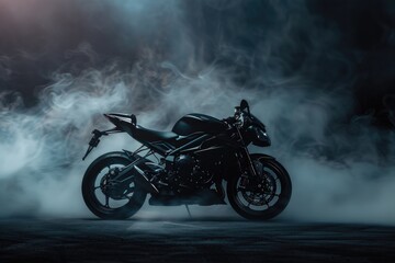 A black motorcycle parked in a foggy area