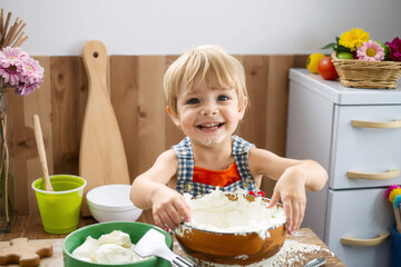 Smiling child with flour on face, happily baking in the kitchen, enjoying the process