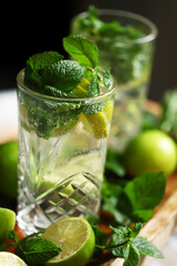 Detox drink with mint lime and mineral water in a glass jar