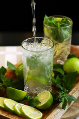 Detox drink with mint lime and mineral water in a glass jar