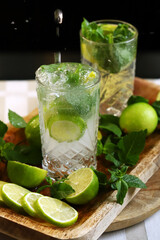 Detox drink with mint lime and mineral water in a glass jar