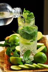 Detox drink with mint lime and mineral water in a glass jar