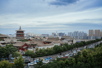 Standing on the ancient city wall of Datong, you can gaze into the distance at the Huayan Temple....