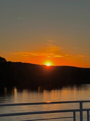 sunset over the river and ship