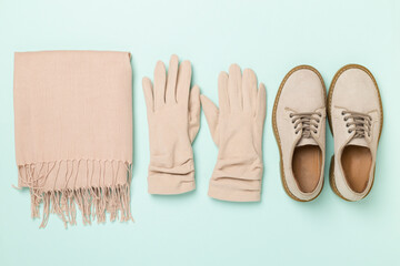 Stylish autumn accessories on color background, top view