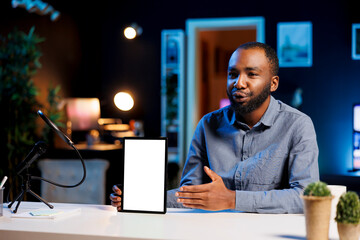 Tech guru excited to review newly released mockup tablet, comparing features with older models....