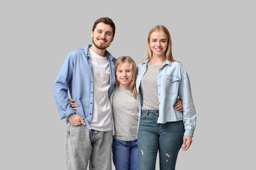 Fototapeta premium Happy family in stylish denim clothes on grey background