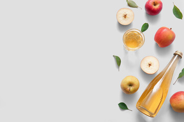Composition with fruits, bottle and glass of fresh apple cider on white background