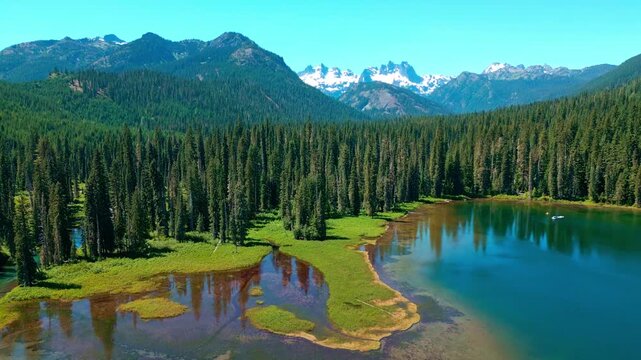 Cooper lake with mountain landscape. Landscape of mountain and forest of Cooper lake. Nature landscape. Cooper Lake in Washington. Scenic nature of popular hiking Cooper lake. Wild nature