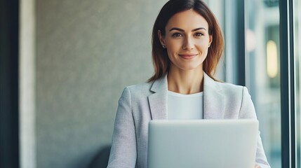 Happy businesswoman with a laptop, innovative strategy, achieving online business success