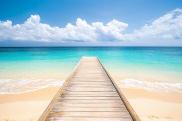Naklejka premium Wooden pier extending into turquoise ocean with white sand beach and clear water in a wide-angle view.