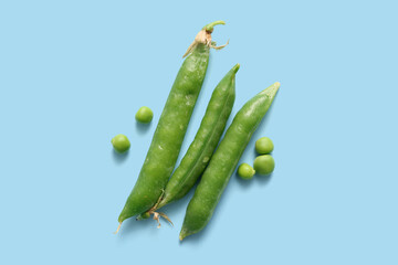 Green peas on blue background