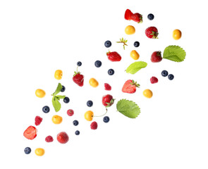 Flying different fresh berries and mint on white background
