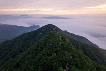 Misty clouds and mountains during sunrise