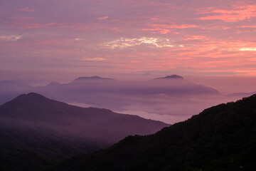 Misty clouds and mountains during sunrise