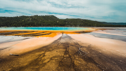 Landscape photography of the beautiful Grand Prismatic Spring hot springs in Yellowstone.