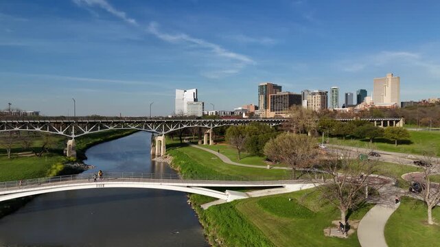 Drone shot of the Trinity River Park in Fort Worth, Texas, featuring lush green spaces.
