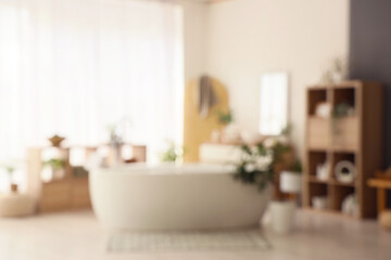 Blurred view of bathroom with bathtub, shelf units and plants