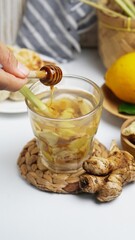 ginger lemon drink with honey drip