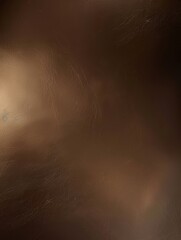 Fototapeta premium A gradient background featuring dark chestnut brown, burnt sienna, and soft cream tones, with subtle white and black specks.