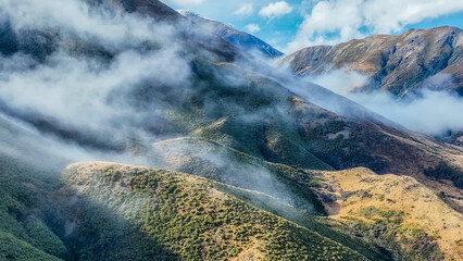 Aerial view of the mountains shrouded in cloud in Torlesse Tussocklands Park