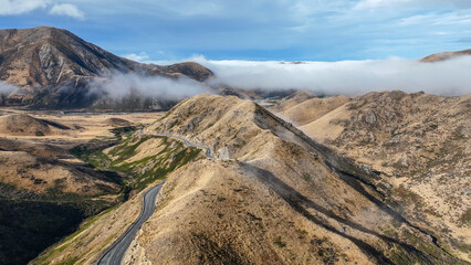 Aerial view of the mountains shrouded in cloud in Torlesse Tussocklands Park