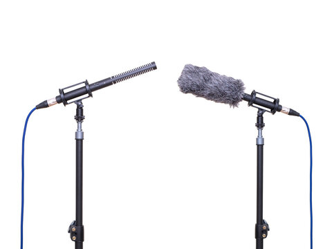 A professional-grade shotgun microphone on a isolated white background, a high-quality audio recording device.