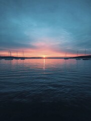 Fototapeta premium An inviting marina scene with boats gently bobbing in the water and a backdrop of a serene sunset reflecting off the waves.