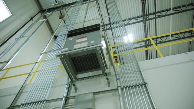 Electrical and air systems communications with cables and metal pipes inside modern building 