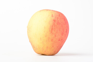 Fresh ripe apple with tiny water drops on white background