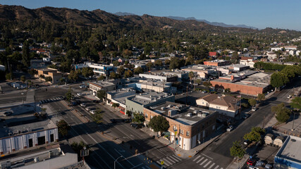 Fototapeta premium Los Angeles, California, USA - August 18, 2024: Late afternoon sunlight shines on the historic downtown Eagle Rock historic core.
