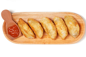 Fried stuffed Cireng, a traditional Indonesian snack filled with seasoned beef fat or jando, perfect with chili sauce dip, photographed against a white background.