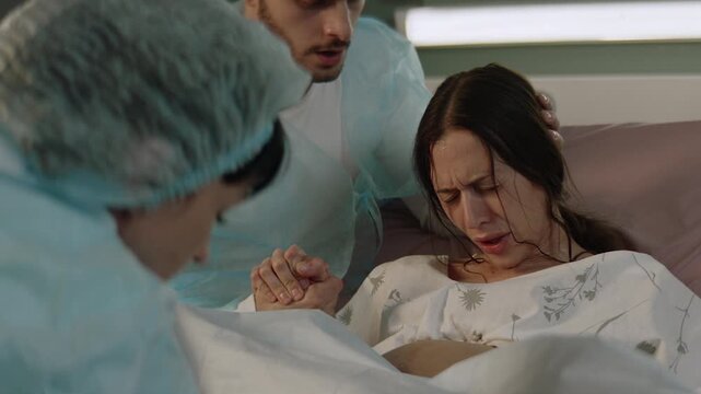 Mother holding her newborn in the hospital