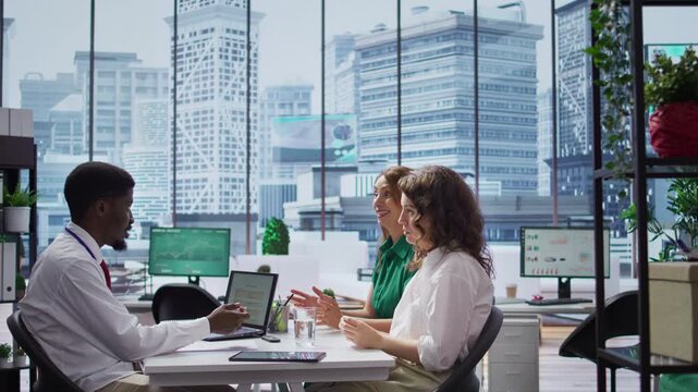 HR expert interviewing two job applicant to fill a vacancy within the organization, talent acquisition. Male recruiter discussing with talented businesswomen with impressive CVs. Camera B.