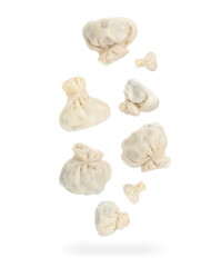Delicious khinkali (Georgian dumplings) falling on white background