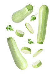 Fresh zucchinis and parsley falling on white background