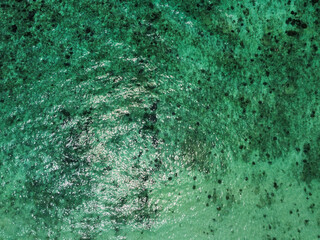 Aerial view of the emerald waters with coral reef in Phi Phi islands, Thailand