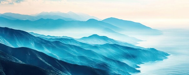 Fototapeta premium Serene mountain landscape with layers of blue hues and soft mist, capturing the beauty of nature's tranquility.