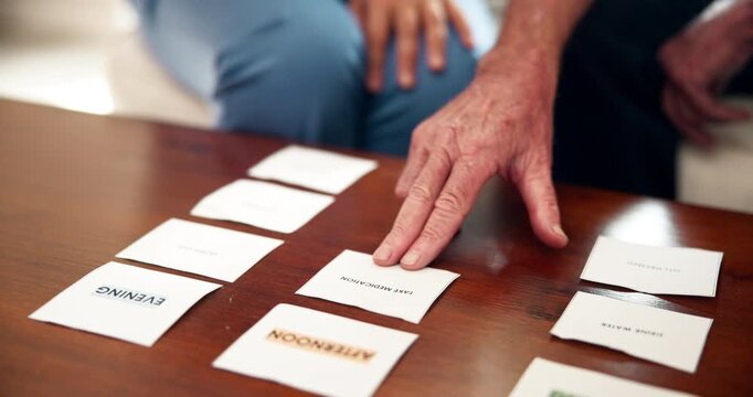 Senior care, therapy and people with memory test for mental health, dementia and mind assessment. Healthcare, elderly person and caregiver with card, puzzle or alzheimer evaluation in nursing home