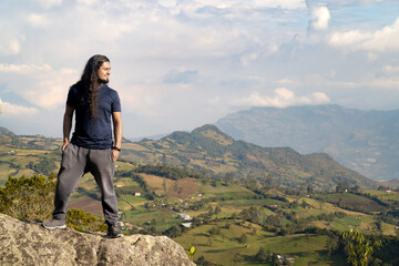 Fototapeta premium latin traveling man admiring the natural landscape