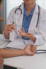 Doctor uses hypodermic needle and syringe to put a dose of medicine as treatment.