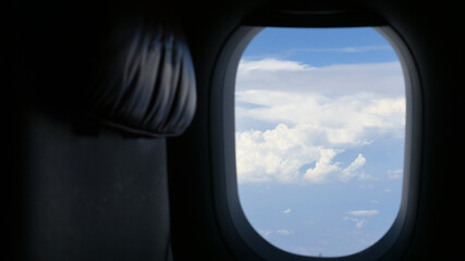 Scenery outside the window of a passenger plane, beautiful blue sky and white cloud view