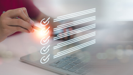 Businesswomen checking marks on the checklist. online checklist survey, filling out digital form checklist. take an assessment, questionnaire, evaluation, online survey, or online exam.