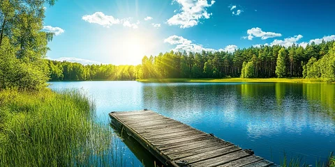 Foto op Plexiglas Beautiful summer landscape with lake and old wooden dock in forest on sunny day, bright blue sky with sun rays. Scandinavian nature background. Summer vacation concept  © Thanthara