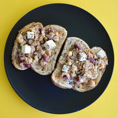 Tuna and bean mix with marinated feta on toasted sourdough multi grain bread. 
