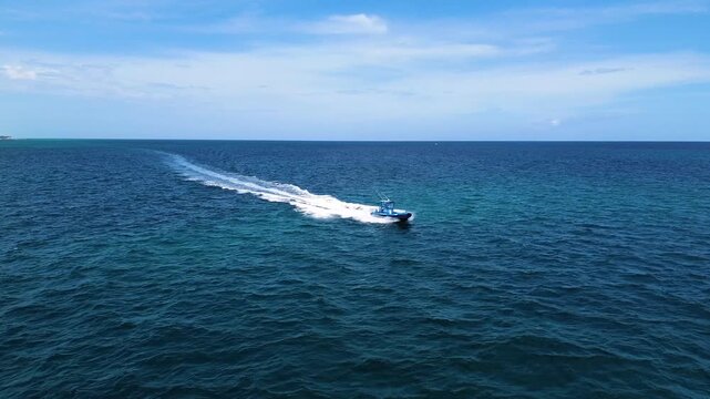 A running shot chasing a RIB boat off the coast of South Florida.