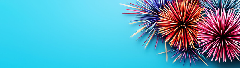 Vibrant fireworks on a blue background with space for text. Perfect for celebrations, holidays, and festive events.