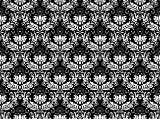 Floral pattern. Vintage wallpaper in the Baroque style. Seamless vector background. White and black ornament for fabric, wallpaper, packaging. Ornate Damask flower ornament.