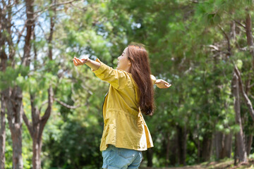 Lifestyle traveler women happy feeling good relax and freedom in the sunrise morning.Travel Concept