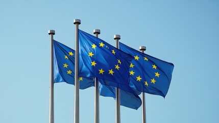 Elegant European Parliament flags fluttering in the wind against a clear sky, symbolizing unity and international cooperation.